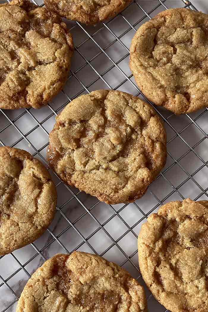 easy homemade chewy brown butter toffee cookies on a cooling rack