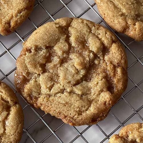 simple homemade chewy brown butter toffee cookies on a cooling rack
