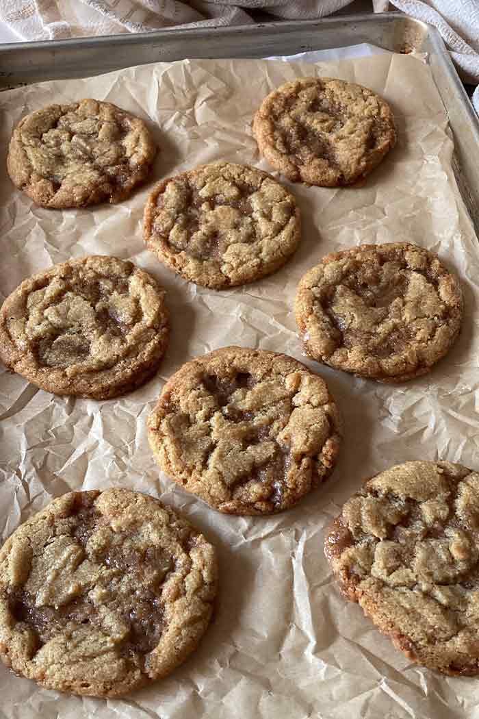 baking sheet with chewy homemade brown butter toffee cookies