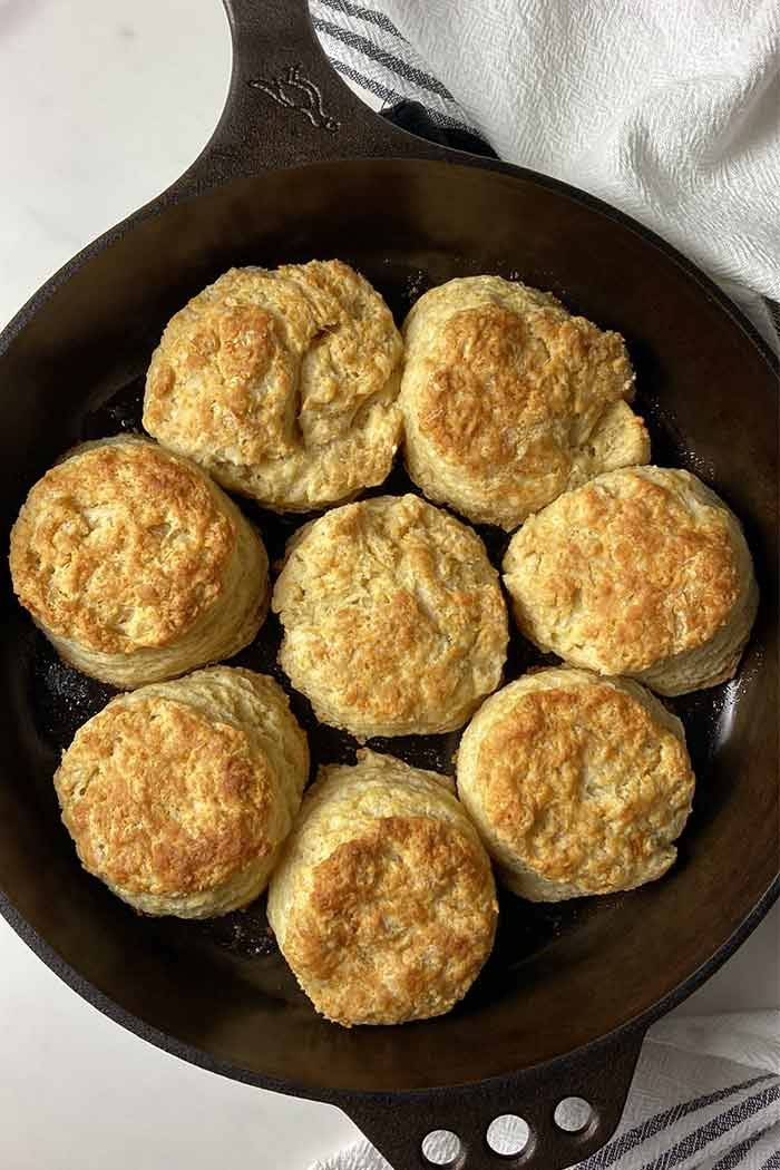 homemade golden brown buttermilk biscuits from scratch in a cast iron skillet