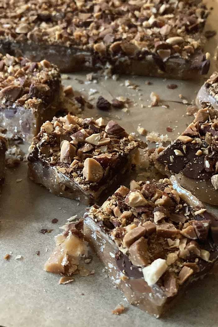 easy homemade english toffee coated with chocolate and almonds broken into bite-sized pieces