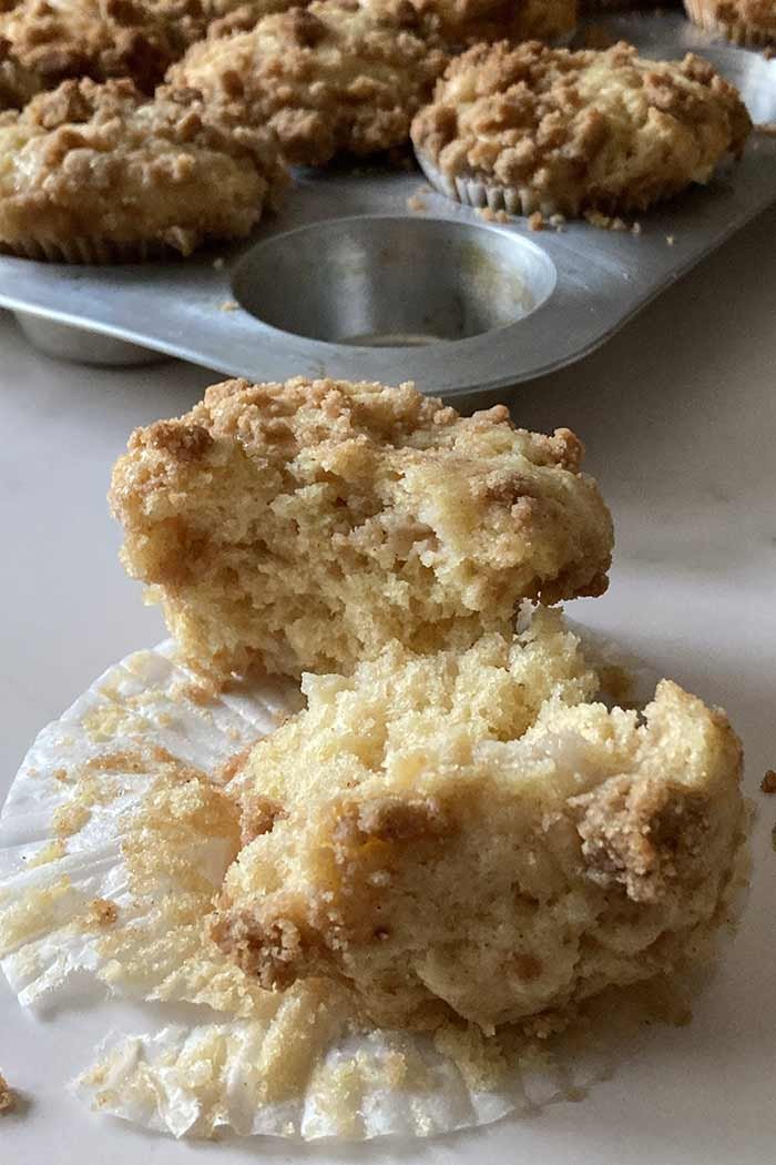 soft and tender pear streusel muffin cut in half showing the internal texture