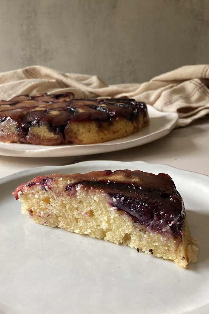 light almond plum upside-down cake slice showing texture