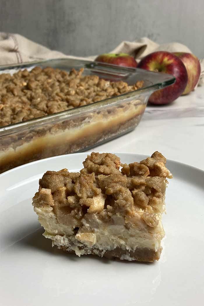 apple crumble cheesecake bar slice on plate