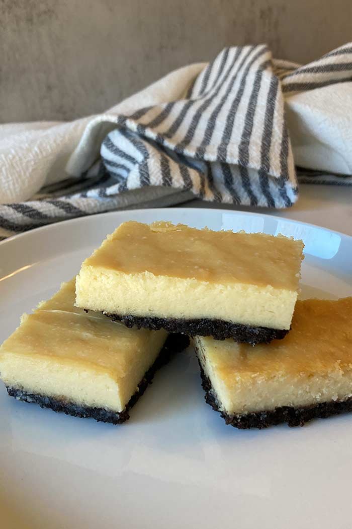 stack of creamy white chocolate Oreo cheesecake bars