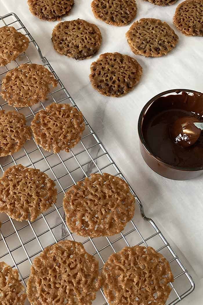 florentine lace cookies in the process of being filled with chocolate