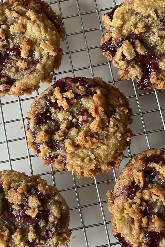 blueberry muffin cookies with streusel topping cooling on a rack
