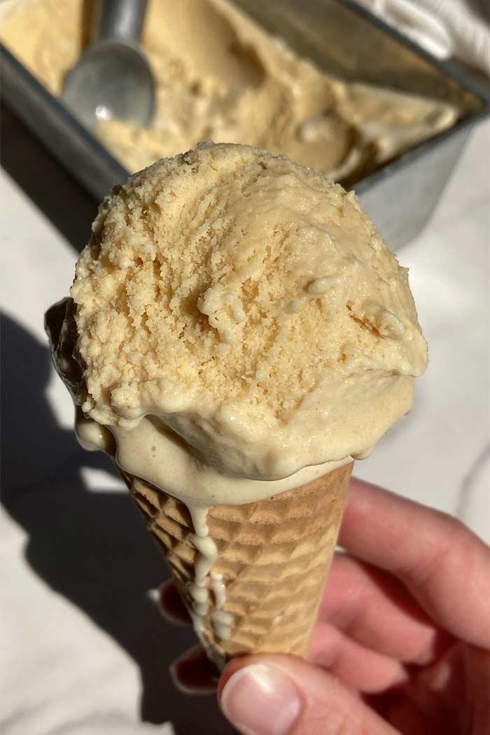 scoop of homemade brown butter ice cream in a cone