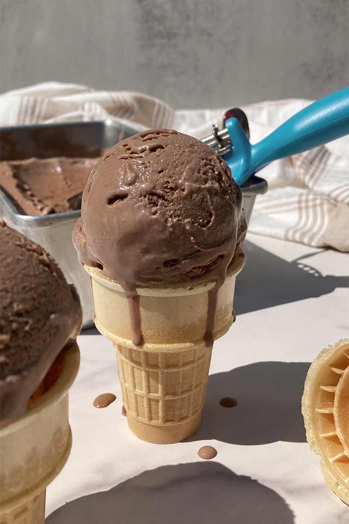 homemade chocolate malt ice cream melting in a cone