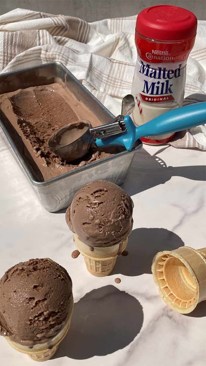 homemade chocolate malt ice cream being scooped into cones