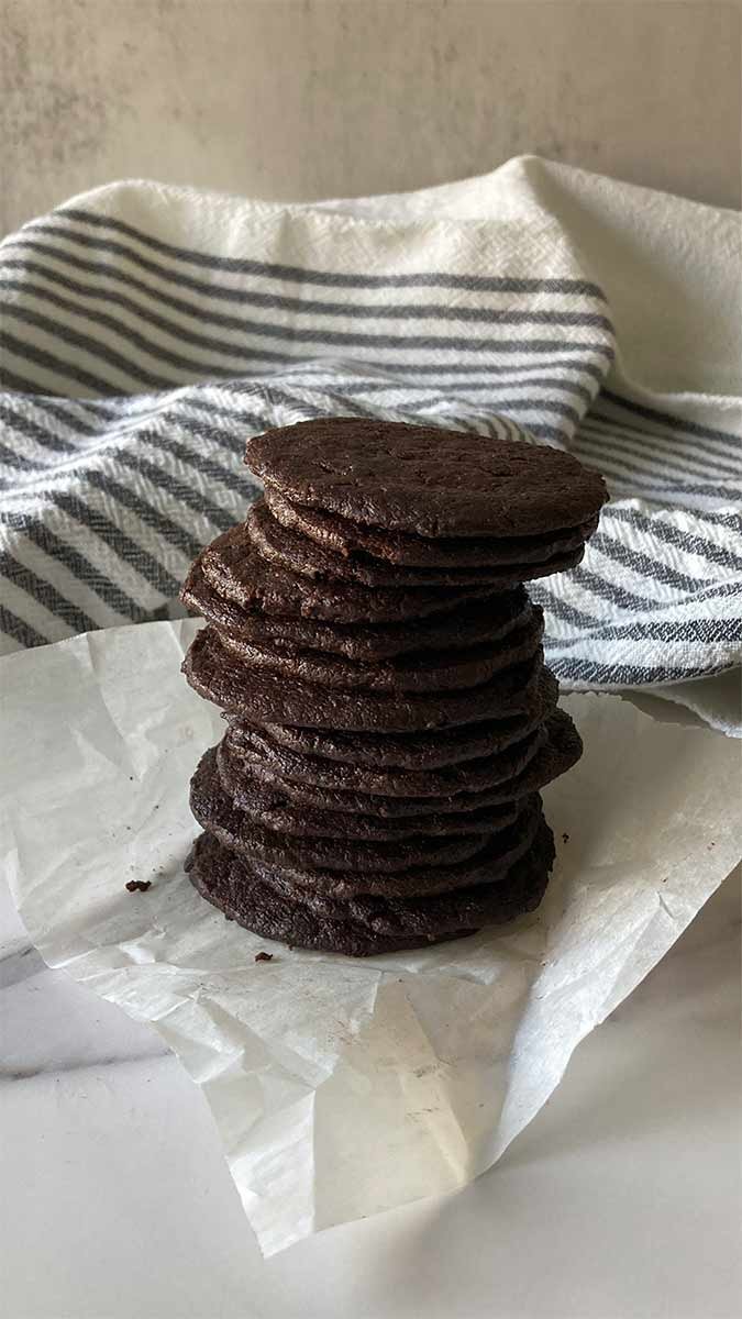 thin and crispy chocolate wafer cookies in a stack