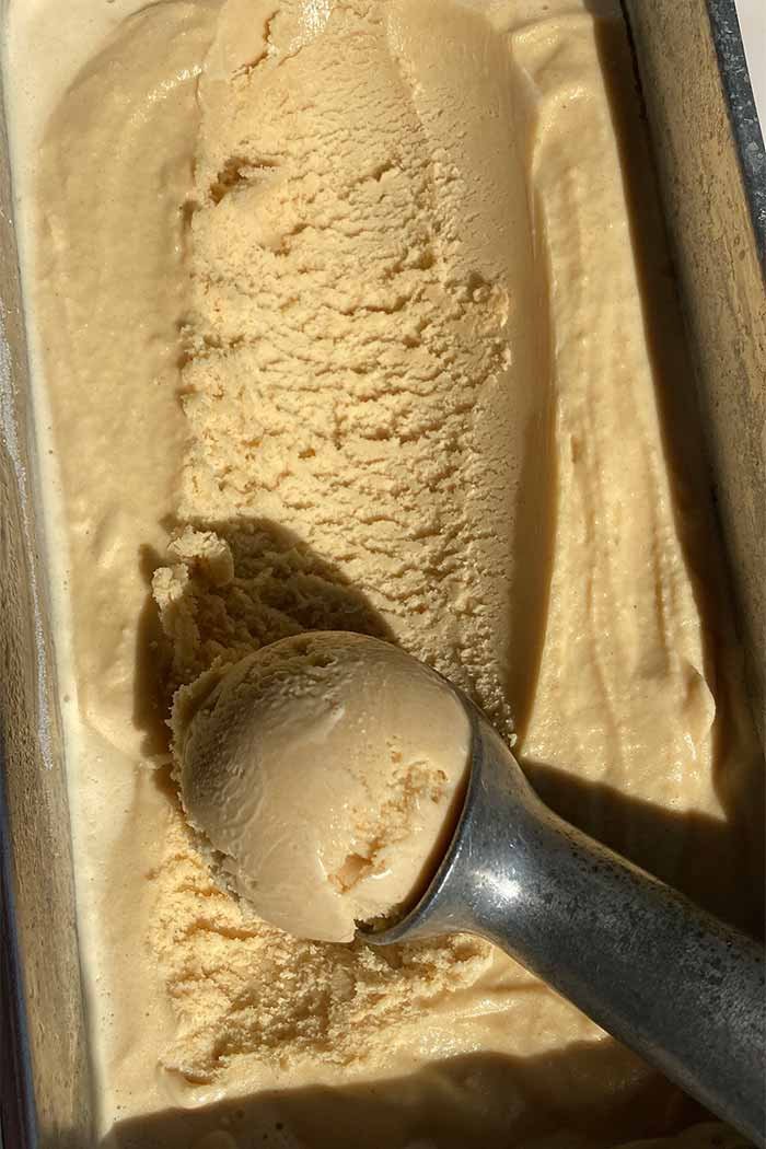 scooping brown butter ice cream to show texture