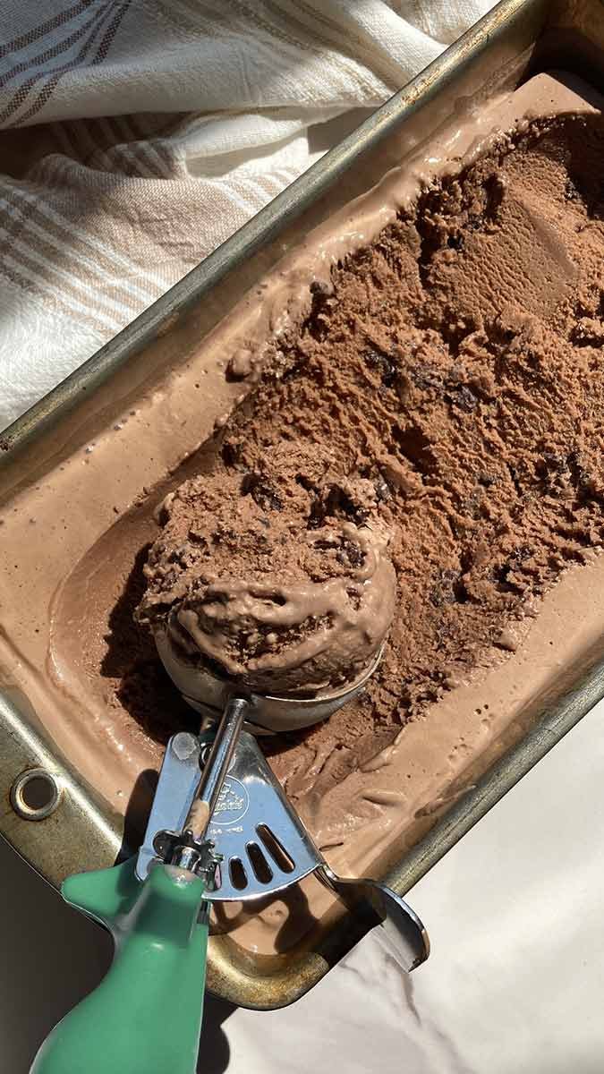 scooping of mocha cookie crunch ice cream showing texture