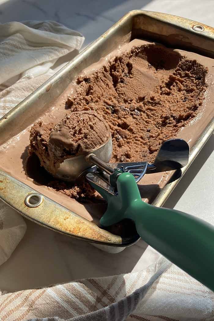 container of mocha cookie crunch ice cream in sunlight