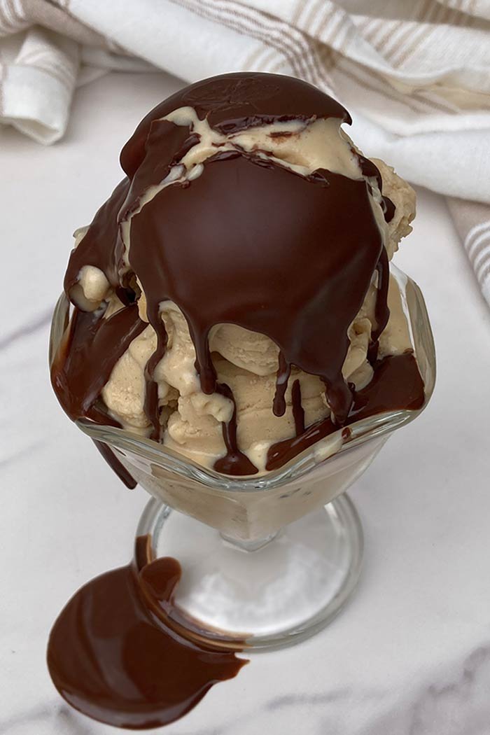 ice cream covered in chocolate magic shell topping that has been broken