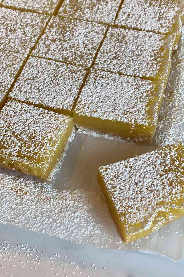 lemon bars dusted with powdered sugar