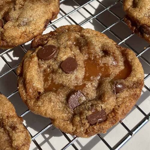 fresh-milled wheat brown butter chocolate chip toffee cookie on a cooling rack