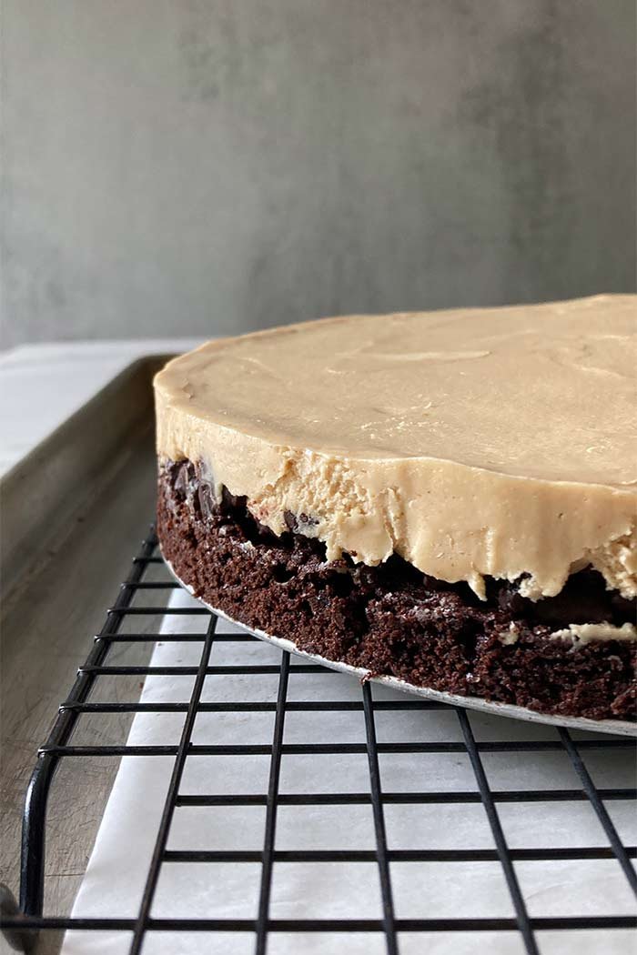 layers of brownie, cookie crunchies, and peanut butter mousse before chocolate ganache coating